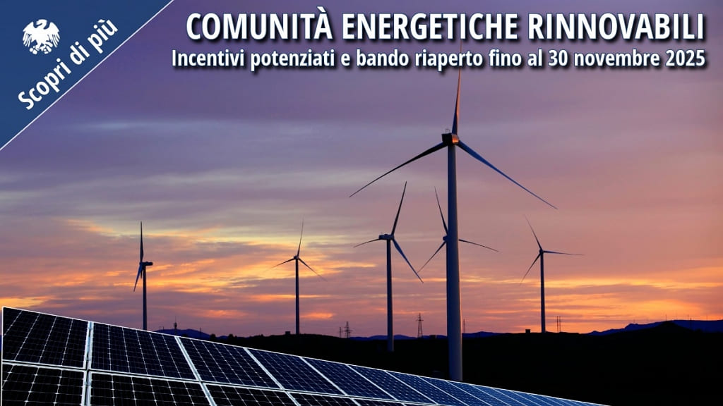 Impianto eolico e pannelli solari al tramonto, simbolo delle comunità energetiche rinnovabili.
