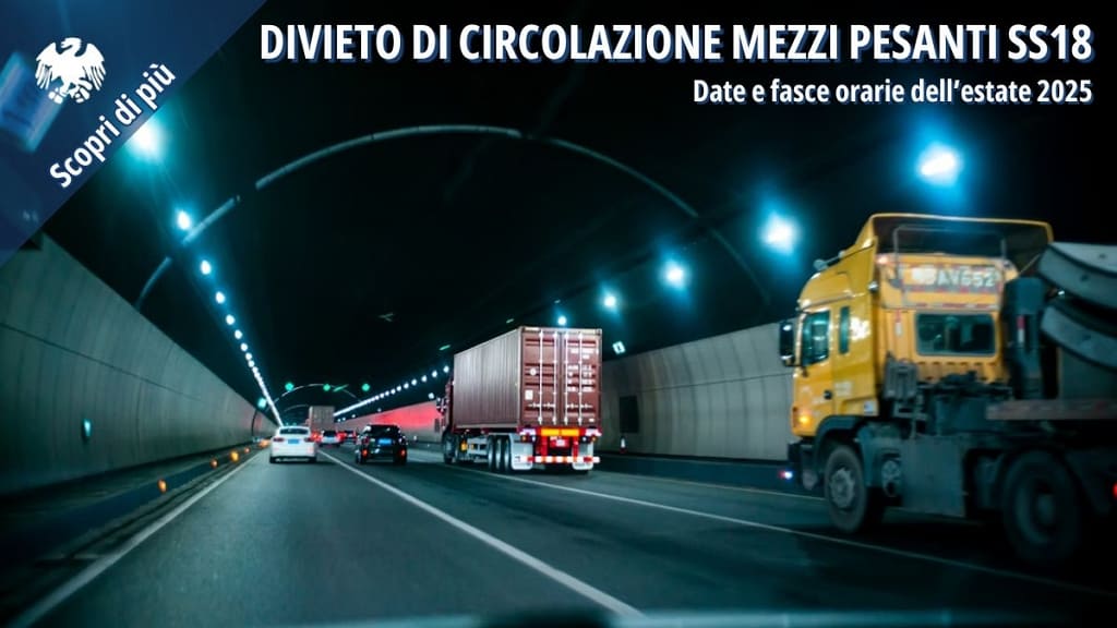 Mezzi pesanti in transito all’interno di una galleria stradale.