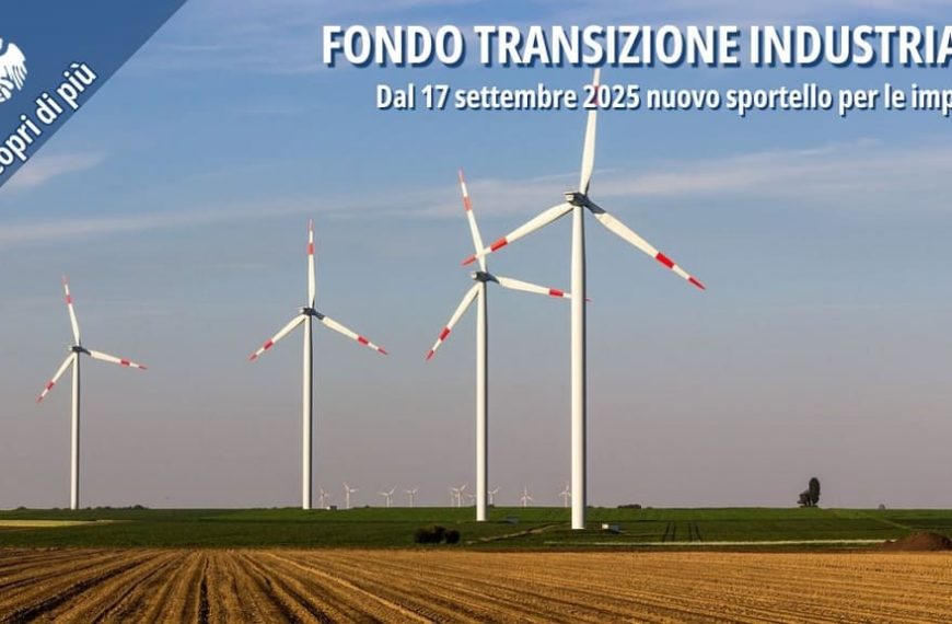 Pale eoliche in un campo agricolo, simbolo della transizione energetica sostenibile.