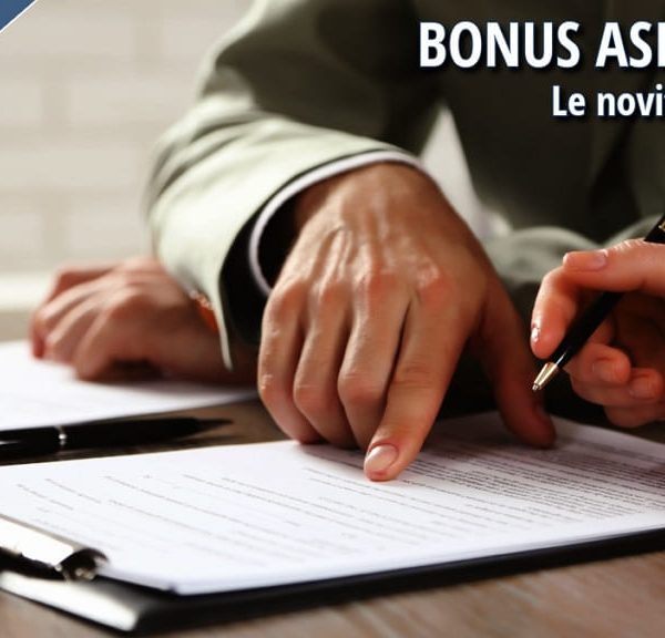Due persone compilano moduli e documenti su una scrivania, a rappresentare le nuove procedure per il Bonus asilo nido 2026 introdotte dall’Inps.