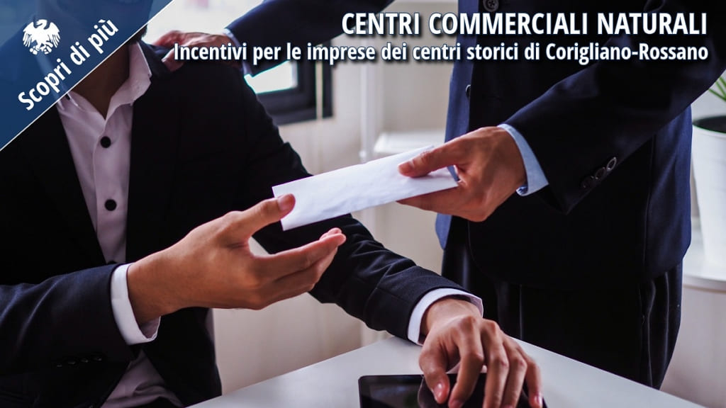 Due uomini d’affari si scambiano una busta, simbolo di incentivi e sostegno economico alle imprese dei centri storici di Corigliano-Rossano.