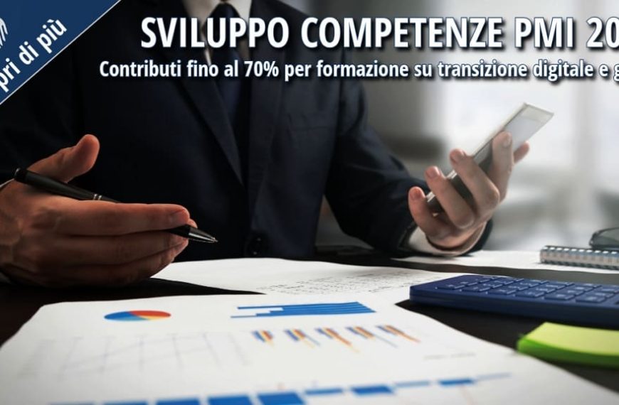 Professionista al lavoro con grafici e calcolatrice – misura Sviluppo Competenze PMI 2026 per la formazione su transizione digitale e green.