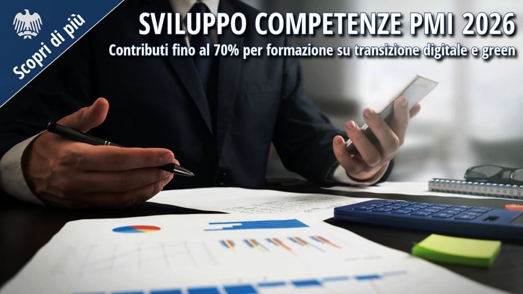 Professionista al lavoro con grafici e calcolatrice – misura Sviluppo Competenze PMI 2026 per la formazione su transizione digitale e green.