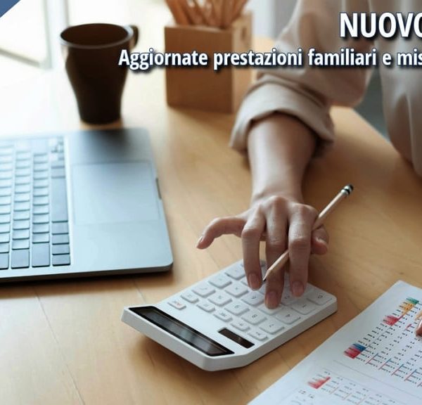 Calcolo ISEE 2026 con computer e calcolatrice per aggiornamento prestazioni familiari e misure di inclusione.