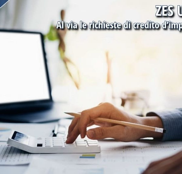 Impresa al lavoro su calcolo credito d’imposta ZES Unica 2026 con computer e documenti contabili.