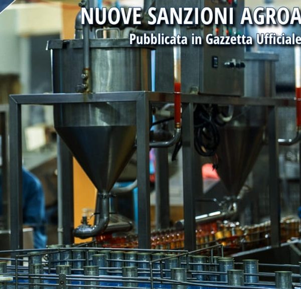 Impianto industriale agroalimentare con operatori al lavoro e controlli di produzione, immagine relativa alle nuove sanzioni agroalimentari introdotte dalla Legge 75/2026.