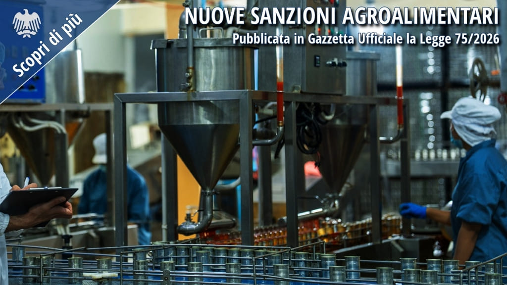 Impianto industriale agroalimentare con operatori al lavoro e controlli di produzione, immagine relativa alle nuove sanzioni agroalimentari introdotte dalla Legge 75/2026.